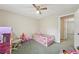Cozy bedroom with a ceiling fan and plenty of space for a play area at 600 Cowan Rd, Covington, GA 30016