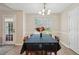 Well-lit dining room featuring wood floors, decorative wainscoting, and a table with seating for six at 600 Cowan Rd, Covington, GA 30016