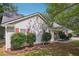 Charming single-story home with light siding, dark shutters, mature landscaping, and a well-maintained lawn at 600 Cowan Rd, Covington, GA 30016