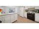 Open-concept kitchen with modern appliances, ample counter space, and a view into the adjacent dining area at 600 Cowan Rd, Covington, GA 30016
