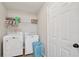 Well-equipped laundry room with modern washer and dryer units and storage at 600 Cowan Rd, Covington, GA 30016