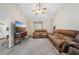 Open living room featuring neutral walls, vaulted ceiling, and ample seating space at 600 Cowan Rd, Covington, GA 30016