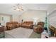 Inviting living room featuring vaulted ceilings, a fireplace, and comfortable sofas; ideal for gatherings at 600 Cowan Rd, Covington, GA 30016
