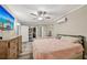 Spacious main bedroom with a ceiling fan, ensuite bathroom, and large closet at 600 Cowan Rd, Covington, GA 30016