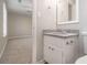 Bathroom vanity with granite countertop and a view into bedroom at 100 Spicewood Ct, South Fulton, GA 30349