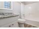 Bathroom with white vanity, granite countertop, and shower and tub combo at 100 Spicewood Ct, South Fulton, GA 30349