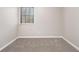 Bedroom featuring neutral carpet, a window, and base trim at 100 Spicewood Ct, South Fulton, GA 30349