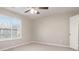 Neutral bedroom with carpet, a window, and ceiling fan at 100 Spicewood Ct, South Fulton, GA 30349