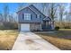 Charming two-story home featuring a stone facade and blue siding at 100 Spicewood Ct, South Fulton, GA 30349