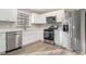 Modern kitchen featuring white cabinets and stainless steel appliances at 100 Spicewood Ct, South Fulton, GA 30349