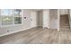 Bright and airy living room with wood floors and staircase at 100 Spicewood Ct, South Fulton, GA 30349