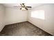 Cozy bedroom with neutral walls, carpet, and ceiling fan fixture at 1200 Ashborough Se Ter # A, Marietta, GA 30067