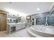 Large bathroom featuring a shower, a tub, and multiple sinks and mirrors at 1565 Kings Xing, Smoke Rise, GA 30087