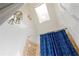 Bathroom showing blue patterned shower curtain with transom window for natural light at 1565 Kings Xing, Smoke Rise, GA 30087