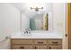 Bathroom featuring vanity with drawers and a large mirror above the countertop at 1565 Kings Xing, Smoke Rise, GA 30087