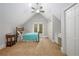 Neutral bedroom with vaulted ceilings, ceiling fan, window, and closet space at 1565 Kings Xing, Smoke Rise, GA 30087