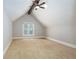 Upstairs bedroom with carpet, a large window, and a ceiling fan at 1565 Kings Xing, Smoke Rise, GA 30087
