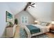 Bright bedroom with vaulted ceilings, ceiling fan, and a large window at 1565 Kings Xing, Smoke Rise, GA 30087