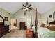Large bedroom with a ceiling fan, a large bed, and doorways to other rooms at 1565 Kings Xing, Smoke Rise, GA 30087