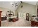 This large bedroom includes a ceiling fan, a bay window, and elegant decorations at 1565 Kings Xing, Smoke Rise, GA 30087