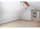 Upstairs bedroom featuring carpet, a window, and a ceiling fan with light at 1565 Kings Xing, Smoke Rise, GA 30087