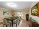 Bright dining room with bay window and stylish furnishings at 1565 Kings Xing, Smoke Rise, GA 30087