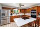Kitchen with stainless steel refrigerator and modern appliances at 1565 Kings Xing, Smoke Rise, GA 30087