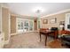 Home office with neutral paint, white trim, a ceiling fan, and double doors leading to outside at 1565 Kings Xing, Smoke Rise, GA 30087