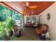 Spacious covered patio with outdoor seating and a ceiling fan at 1565 Kings Xing, Smoke Rise, GA 30087