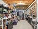 Unfinished basement with open ceiling, storage shelves, and workspace at 505 Armor Knl, Powder Springs, GA 30127
