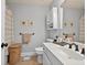 Bathroom with sink, shower, toilet, and cabinets for storage at 505 Armor Knl, Powder Springs, GA 30127