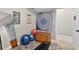 Clean, well equipped home gym featuring a full length mirror and exercise balls at 505 Armor Knl, Powder Springs, GA 30127