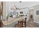Modern kitchen with granite island, stainless steel appliances, pendant lighting and eating bar at 505 Armor Knl, Powder Springs, GA 30127