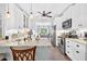 Stylish kitchen with granite countertops, white cabinets, stainless steel appliances, and a view to the dining area at 505 Armor Knl, Powder Springs, GA 30127