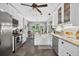 Bright, open kitchen with stainless steel appliances, white cabinets, and a view of the breakfast area at 505 Armor Knl, Powder Springs, GA 30127