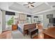 This spacious main bedroom features tray ceilings, wood floors and an attached home office space at 505 Armor Knl, Powder Springs, GA 30127