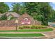 Community entrance sign for Brookshire Pond featuring stone masonry and a landscaped flower bed at 505 Armor Knl, Powder Springs, GA 30127