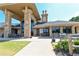 Community clubhouse with stone facade, outdoor seating, and covered entrance for residents at 5347 Harbury Cv, Suwanee, GA 30024