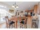 Dining room with hardwood floors and a view into the kitchen at 5347 Harbury Cv, Suwanee, GA 30024