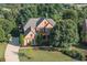 Beautiful brick two-story home with a landscaped yard and long driveway at 5347 Harbury Cv, Suwanee, GA 30024