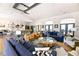 Open living room with vaulted ceilings, stylish decor, and seamless flow to the kitchen area at 5347 Harbury Cv, Suwanee, GA 30024
