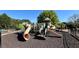 Community playground offering children various slides and climbing structures in a secure environment at 5347 Harbury Cv, Suwanee, GA 30024