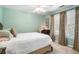 Comfortable bedroom with a large bed, soft lighting, and serene atmosphere perfect for relaxation at 6380 Bannerhorn Run, Alpharetta, GA 30005