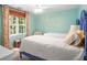 Bright bedroom with two twin beds, floral curtains, and light-colored walls for a cheerful ambiance at 6380 Bannerhorn Run, Alpharetta, GA 30005