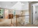 Hallway features skylight, staircase, railing, and multiple doors and entry ways at 6380 Bannerhorn Run, Alpharetta, GA 30005