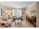 Comfortable living room with neutral colors, plush seating, and a view of the outdoors at 6380 Bannerhorn Run, Alpharetta, GA 30005