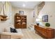 Welcoming living room with comfortable seating, built-in bookshelves, and staircase access at 6380 Bannerhorn Run, Alpharetta, GA 30005