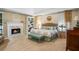 Spacious main bedroom with a fireplace, sitting area, and ensuite bathroom at 6380 Bannerhorn Run, Alpharetta, GA 30005