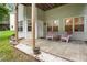 Outdoor patio with seating offers a relaxing space next to the green lawn at 6380 Bannerhorn Run, Alpharetta, GA 30005