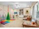 Vibrant playroom with soft padded flooring, a swing, and built-in shelves for fun and storage at 6380 Bannerhorn Run, Alpharetta, GA 30005